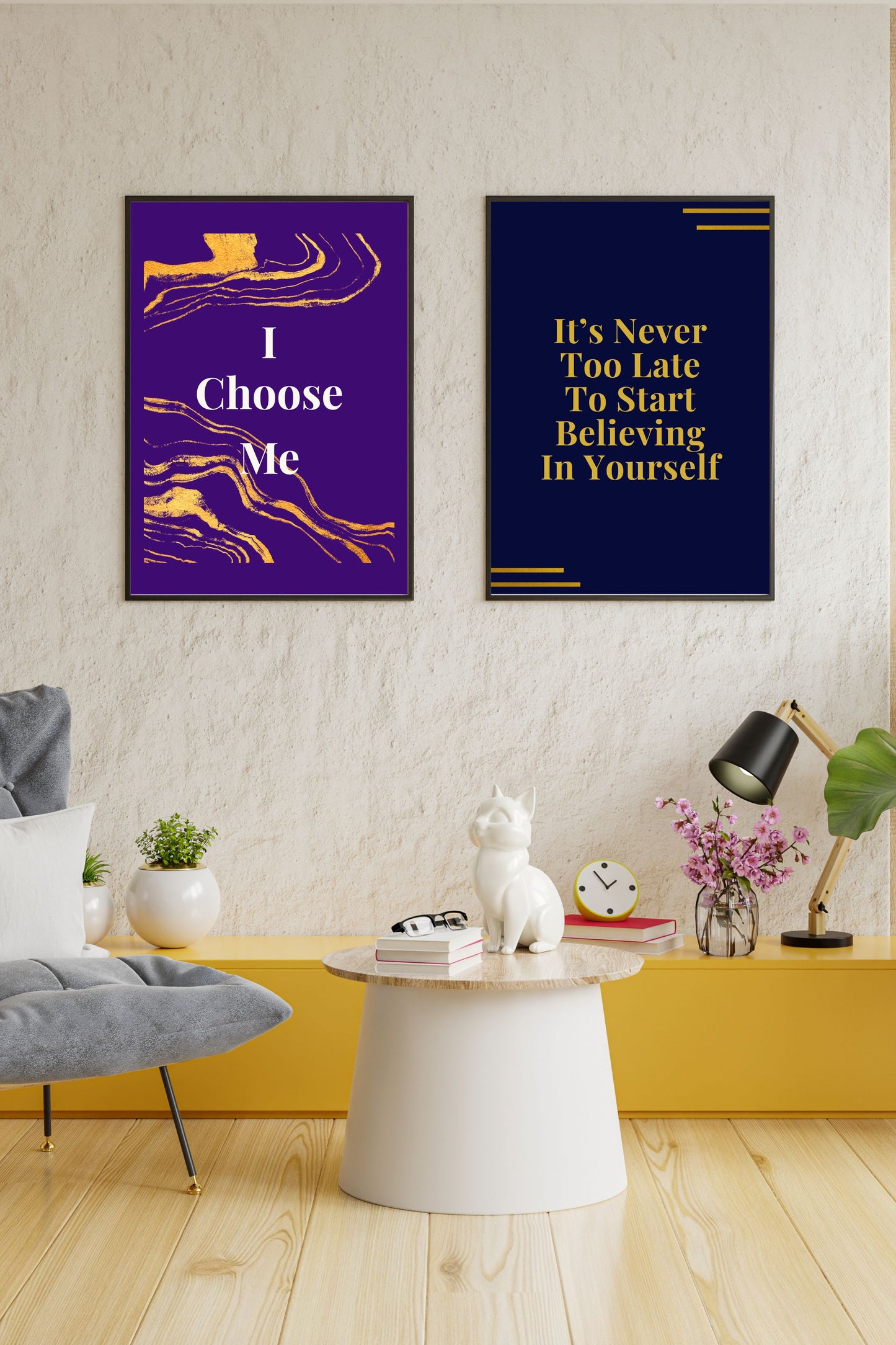 Motivational printable wall art set featuring two prints: "I Choose Me" in bold white and gold on a vibrant violet background, and "It’s Never Too Late To Start Believing In Yourself" in gold on navy, both displayed in a modern, cozy living space with a yellow shelf, plants, and stylish decor.