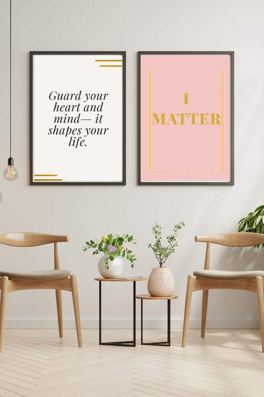 Motivational printable wall art featuring the quote "I Matter" in bold gold typography on a blush pink background, displayed with a minimalist "Guard your heart and mind — it shapes your life" print in a modern, bright sitting area with wooden chairs and floral accents.