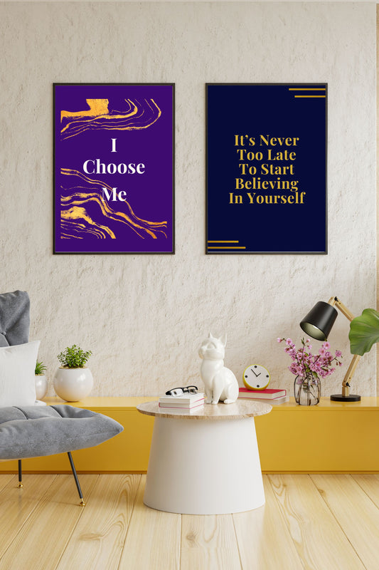 Motivational printable wall art set featuring two prints: "I Choose Me" in bold white and gold on a vibrant violet background, and "It’s Never Too Late To Start Believing In Yourself" in gold on navy, both displayed in a modern, cozy living space with a yellow shelf, plants, and stylish decor.